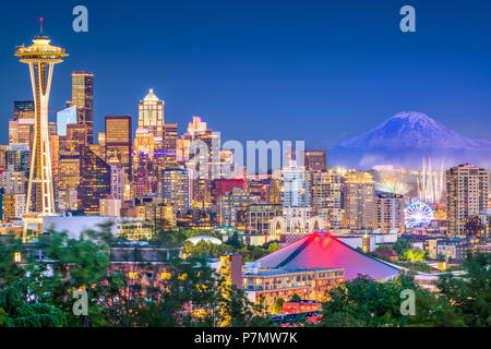 Seattle, Washington, USA downtown skyline at night with Mt. Rainier. Stock Photo