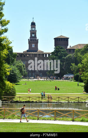 Italy, Lombardy, Milan, Simplon park (parco Sempione), Castello Sforzesco (Sforza Castle), built in the 15th century by Duke of Milan Francesco Sforza, Torre del Filarete, tower built by architect Antonio di Pietro Averlino (or Averulino) also known as Filarete Stock Photo