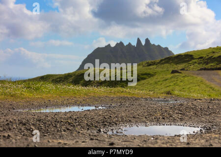 Meadows and rocky peaks, Bour, Vagar island, Faroe Islands, Denmark Stock Photo