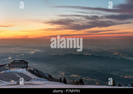 Monte Grappa, province of Vicenza, Veneto, Italy, Europe, The refuge Bassano. The sun rises above the Venetian Plain Stock Photo