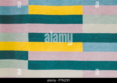 Colorful carpet with hand made graphic pattern. Stock Photo