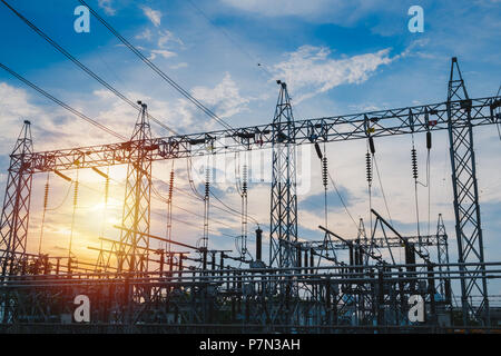Sunset behind substation towers with blue sky Photo Stock Photo - Alamy