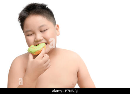 Obese fat boy enjoy to  eating donut isolated on white background, junk food and dieting concept Stock Photo