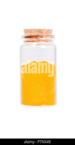 Yellow curry powder in a glass bottle with cork stopper, isolate Stock Photo