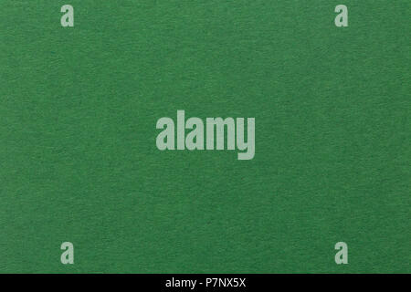 Textured dark green paper as background. Stock Photo