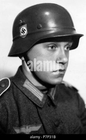 Soldier of the Wehrmacht, boy, looking lost, ca. 1941, exact place unknown, Germany Stock Photo