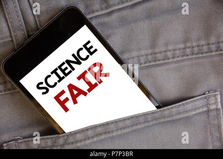 Handwriting texts writing Science Fair. Concept meaning School competition where contestants present projectsConcept on cell phone into jean pocket wh Stock Photo