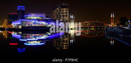 Salford Quays at night including the Lowry Centre & Millenium FootBridge. Stock Photo