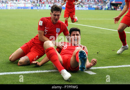 England's Harry Maguire (right) celebrates scoring his side's first goal of the game with John Stones during the FIFA World Cup, Quarter Final match at the Samara Stadium. Stock Photo