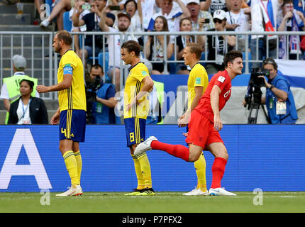 England's Harry Maguire (right) celebrates scoring his side's first goal of the game during the FIFA World Cup, Quarter Final match at the Samara Stadium. Stock Photo
