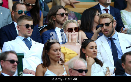 Adam Peaty, Camilla Kerslake-Morgan and Chris Robshaw in the royal box on centre court on day six of the Wimbledon Championships at the All England Lawn tennis and Croquet Club, Wimbledon. PRESS ASSOCIATION Photo. Picture date: Saturday July 7, 2018. See PA story tennis Wimbledon. Photo credit should read: Nigel French/PA Wire. RESTRICTIONS: Editorial use only. No commercial use without prior written consent of the AELTC. Still image use only - no moving images to emulate broadcast. No superimposing or removal of sponsor/ad logos. Call +44 (0)1158 447447 for further information. Stock Photo