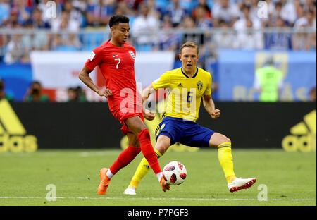 England's Jesse Lingard (left) and Sweden's Ludwig Augustinsson battle for the ball during the FIFA World Cup, Quarter Final match at the Samara Stadium. Stock Photo