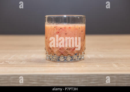 Glass of healthy cocktail with chia seeds, mango,raspberry and coconut water Stock Photo