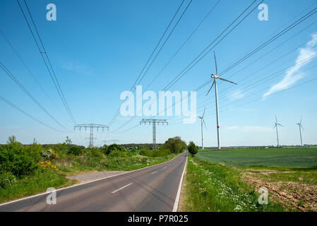 Highway, power transmission lines and wind energy plants seen in Germany Stock Photo