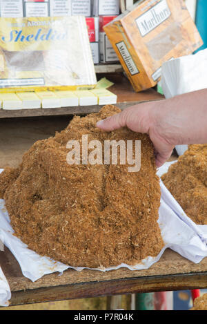 fresh cut tobacco heap at market in Skhodra, Albania Stock Photo