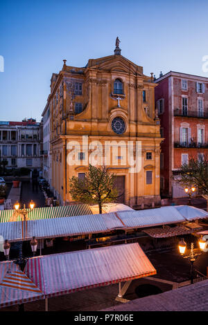 France, Nice city, Chapelle de la Misericorde (Chapel of Mercy) Baroque church and canopies on Cours Saleya market in Old Town at dawn Stock Photo