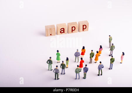 People are looking at the inscription of the app on a white background. Sale of new domain names. Top Level domains are already on sale. Internet and  Stock Photo