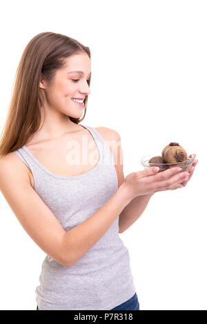 Beautiful blonde woman holding some fresh beets, isolated over white background Stock Photo