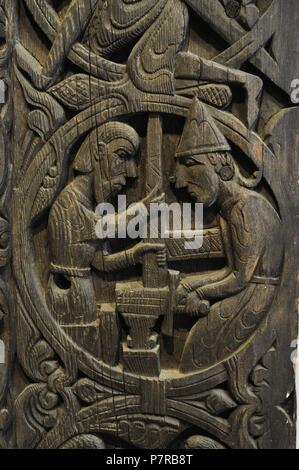 Norway. Setesdal. Hylestad church. Stave-church portal.  c. 1200. Carved on the panels are scenes from the 'Sigurd Favnesbane' stories. Relief carving in wood and depicting the sword Gram finished which is tried on the anvil and it breaks. Historical Museum. Oslo. Norway. Stock Photo