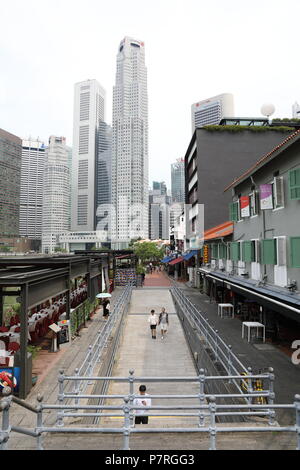 Singapore - APR 2018, Commercial area around Boat Quay between Elgin and Anderson Bridge in the evening, the most crowded area of Singapore night Stock Photo