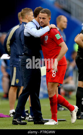 England's Jordan Henderson (right) with England manager Gareth Southgate (left) after being substituted off during the FIFA World Cup, Quarter Final match at the Samara Stadium. Stock Photo