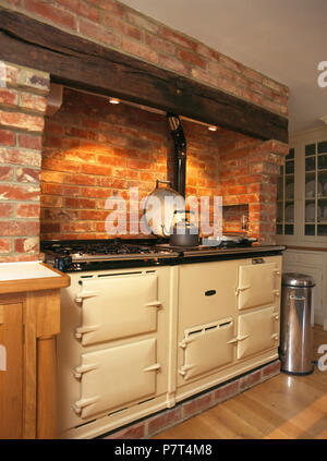 Cream Aga in a country kitchen with an exposed brick wall and rustic ...