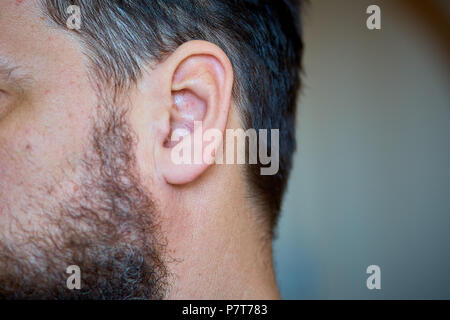man's ear, close-up Stock Photo
