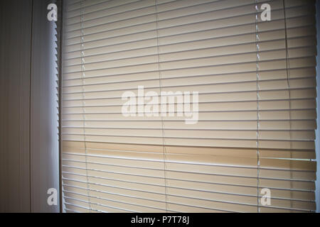 Sunlight coming through venetian blinds by the window Stock Photo