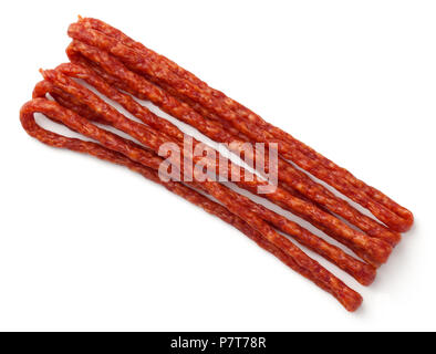 Thin smoked sausage isolated on white background. Kabanos sausage. Top view Stock Photo