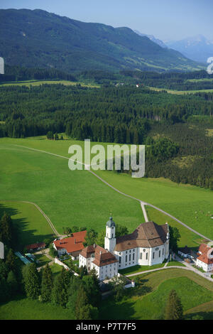 AERIAL VIEW. Historic Church of Wies with the Northern Alps' foothills in the distance. Steingaden, District of Weilheim-Schongau, Bavaria, Germany. Stock Photo