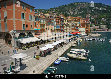 AERIAL VIEW from a 6-meter mast. Row of restaurants alongside the waterfront. Villefranche-sur-Mer, French Riviera, Alpes-Maritimes, France. Stock Photo