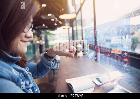 people using smartphone with business data hologram bring out from phone screen future technology Stock Photo