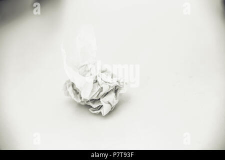 Crumpled paper on white table background Stock Photo