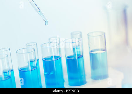 Science Glass test tube blue color in research lab for sci background wallpaper. Stock Photo