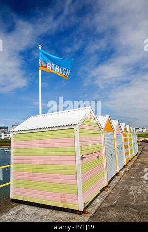 UK, Northern Ireland, Co Antrim, Portrush, beach huts on the harbour south pier Stock Photo