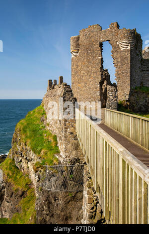 UK, Northern Ireland, Co Antrim, Dunluce Castle, walkway to gatehouse Stock Photo
