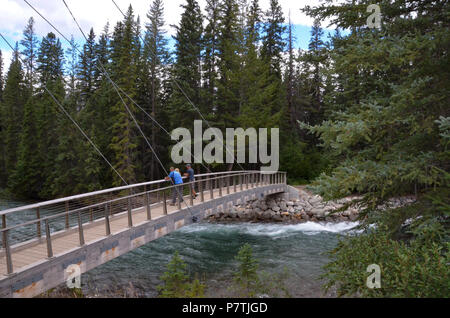 JASPER, AB / CANADA - JULY 23, 2017:  Tourists view  the river near Maligne Canyon from a bridge in Jasper National Park. Stock Photo