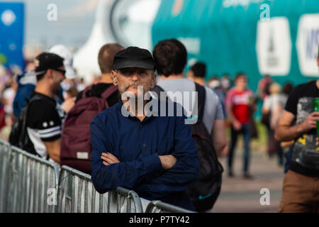 MOSCOW, RUSSIA - SATURDAY, JULY 7, 2018: Fan Fest Moscow, Vorobyovy Gory near Moscow State University. Fans watch FIFA games on large screens here. Cheerful mood, beautiful cityscapes. The area capacity is more than 30000 people. Football lovers from many countries meet here. People watch England vs Sweden game and are getting ready for Russia vs Croatia game. Unidentified experienced football fun quietly watches the game. Credit: Alex's Pictures/Alamy Live News Stock Photo