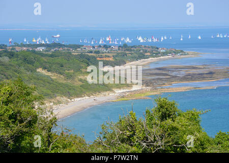 Culver Down, UK. 07th July, 2018. Yachts passing the eastern most point of the Island during the 'Round The Island Yacht Race' 2018. Photograph taken from Culver Down on the Isle of Wight overlooking Whitecliff Bay and Portsmouth as the yachts sail through the Solent Channel towards the finish line in Cowes. Credit: Matthew Blythe/Alamy Live News Stock Photo