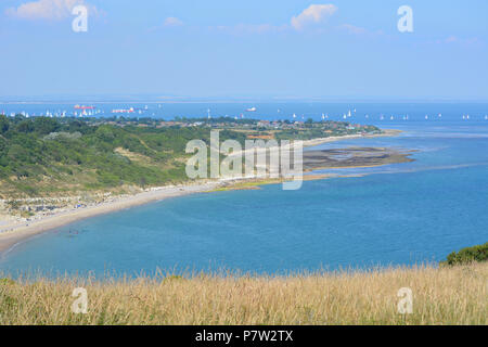 Culver Down, UK. 07th July, 2018. Yachts passing the eastern most point of the Island during the 'Round The Island Yacht Race' 2018. Photograph taken from Culver Down on the Isle of Wight overlooking Whitecliff Bay and Portsmouth as the yachts sail through the Solent Channel towards the finish line in Cowes. Credit: Matthew Blythe/Alamy Live News Stock Photo