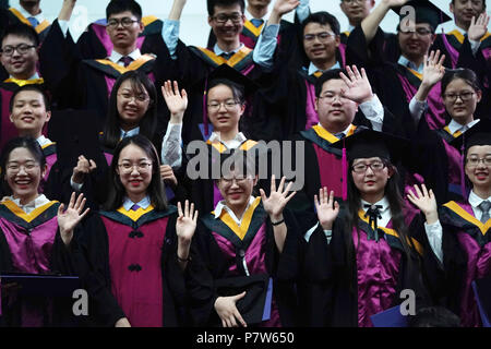 Beijing, China. 8th July, 2018. Graduates pose for photos during the 2018 commencement ceremony of Tsinghua University held in Beijing, capital of China, July 8, 2018. Over 3,000 graduates attended the ceremony on Sunday. Credit: Ju Huanzong/Xinhua/Alamy Live News Stock Photo