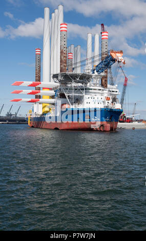 Sassnitz, Germany. 02nd July, 2018. The wind turbine installation vessel SEA CHALLENGER heads out from Mukran Port laden with parts for the Arkona offshore wind farm. Credit: Stefan Sauer/dpa-Zentralbild/dpa/Alamy Live News Stock Photo