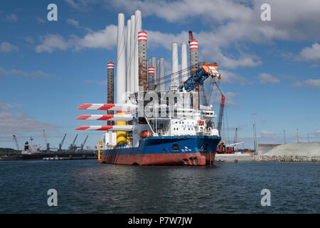 Sassnitz, Germany. 02nd July, 2018. The wind turbine installation vessel SEA CHALLENGER heads out from Mukran Port laden with parts for the Arkona offshore wind farm. Credit: Stefan Sauer/dpa-Zentralbild/dpa/Alamy Live News Stock Photo