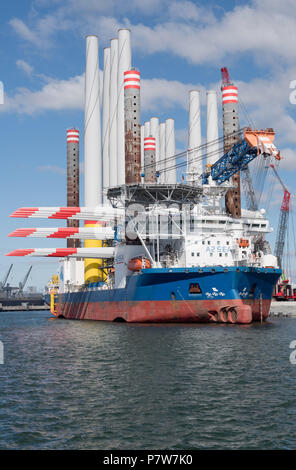 Sassnitz, Germany. 02nd July, 2018. The wind turbine installation vessel SEA CHALLENGER heads out from Mukran Port laden with parts for the Arkona offshore wind farm. Credit: Stefan Sauer/dpa-Zentralbild/dpa/Alamy Live News Stock Photo