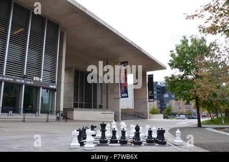 GRAND RAPIDS, MI / USA - OCTOBER 15, 2017:  A chess game outside the Grand Rapids Art Museum, awaits the next players. Stock Photo
