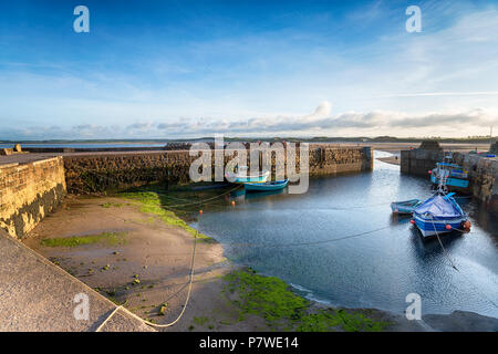 Fishing boats at Beadnell Harbour on the Northumberland coast. Stock Photo