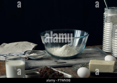 Ingredients for cooking cross buns in the home rustic kitchen Stock Photo