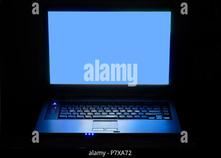 Laptop notebook computer open screen top  illuminated at night Stock Photo