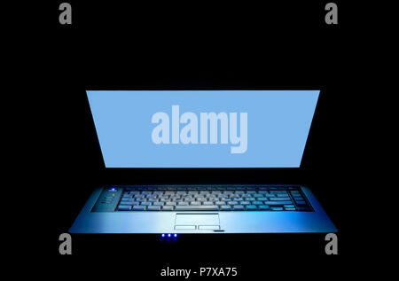 Laptop notebook computer open screen top  illuminated at night Stock Photo