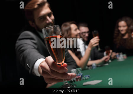 poker player with a glass of wine Stock Photo